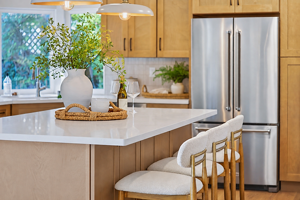 Kitchen interior design example. Wood cabinets, quartz counters and WOW tile bar backsplash and stylish pendants