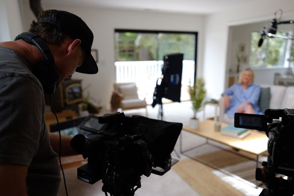 woman sitting on a couch being filmed