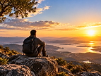 Hiker overlooking a sunset for an executive reset.