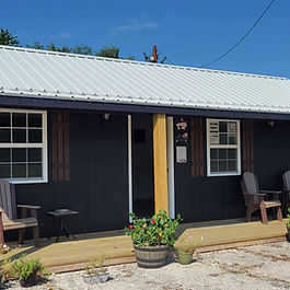 a picture of a bungalow cabin with description of size, style, colors and available siding options on this model of unit