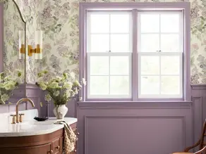 Floral wallpaper with coordinating lavender paint in elegant living room