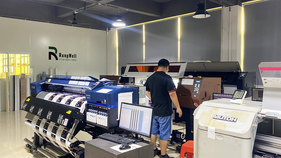 RunpWell technician operating digital printing systems in a color-controlled factory environment. This image highlights RunpWell’s commitment to real-time MES color monitoring, dual-proof sampling, and precision registration to prevent color mismatch from proof to final production.