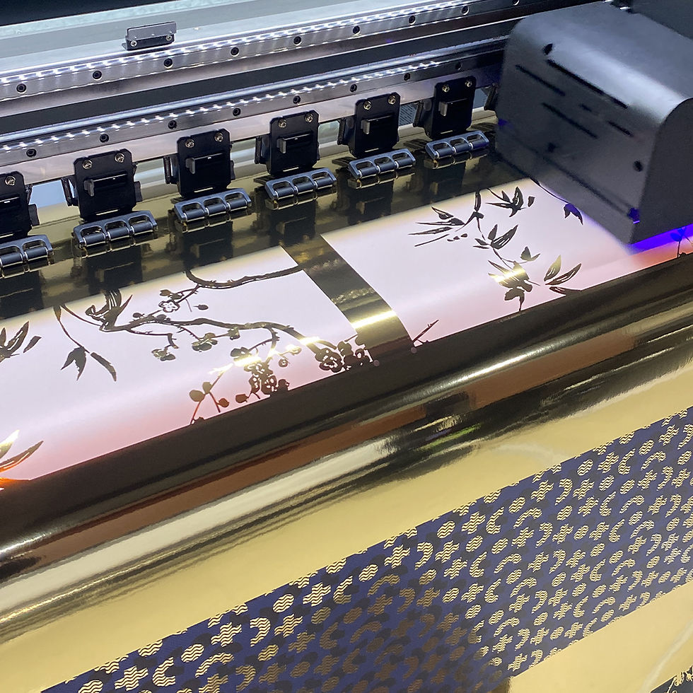 Printer creating a floral pattern on light pink paper. The machine emits a blue light, with metallic and patterned details around it.