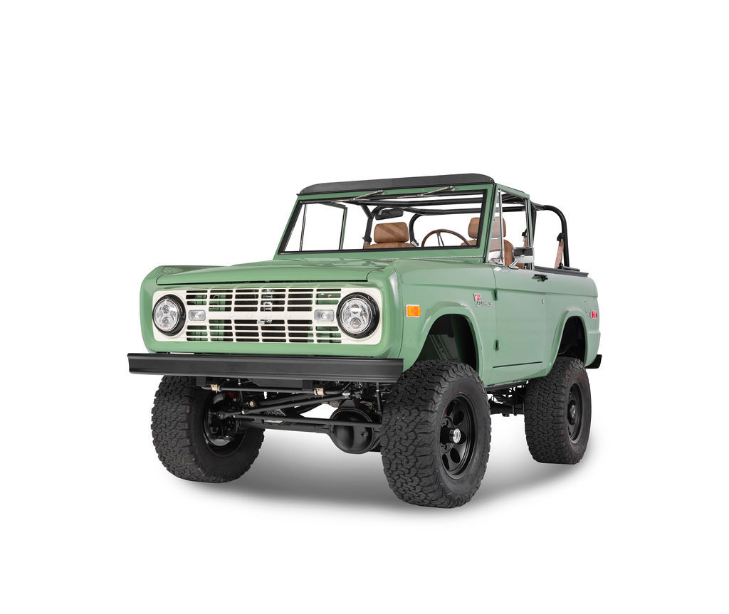 Classic Ford Bronco in Boxwood Green with matte black wheels and vintage leather interior.