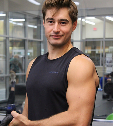 Portrait of personal trainer George Kostopoulos in the gym
