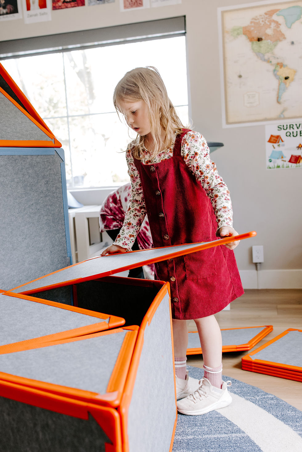 Young child plays with Montessori materials