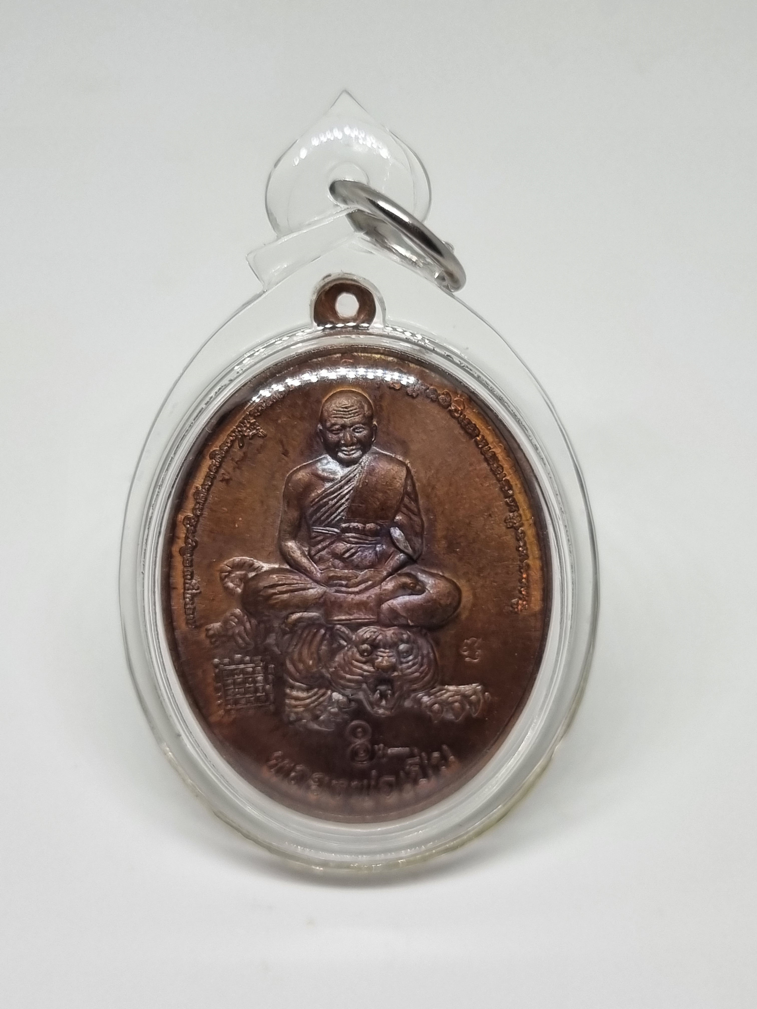 LP Pern Sitting on a Tiger