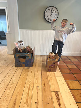Kids making cars from boxes
