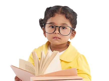 toddler with glasses holding a book