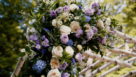 Colorful flowers on ceremony arch in Maine