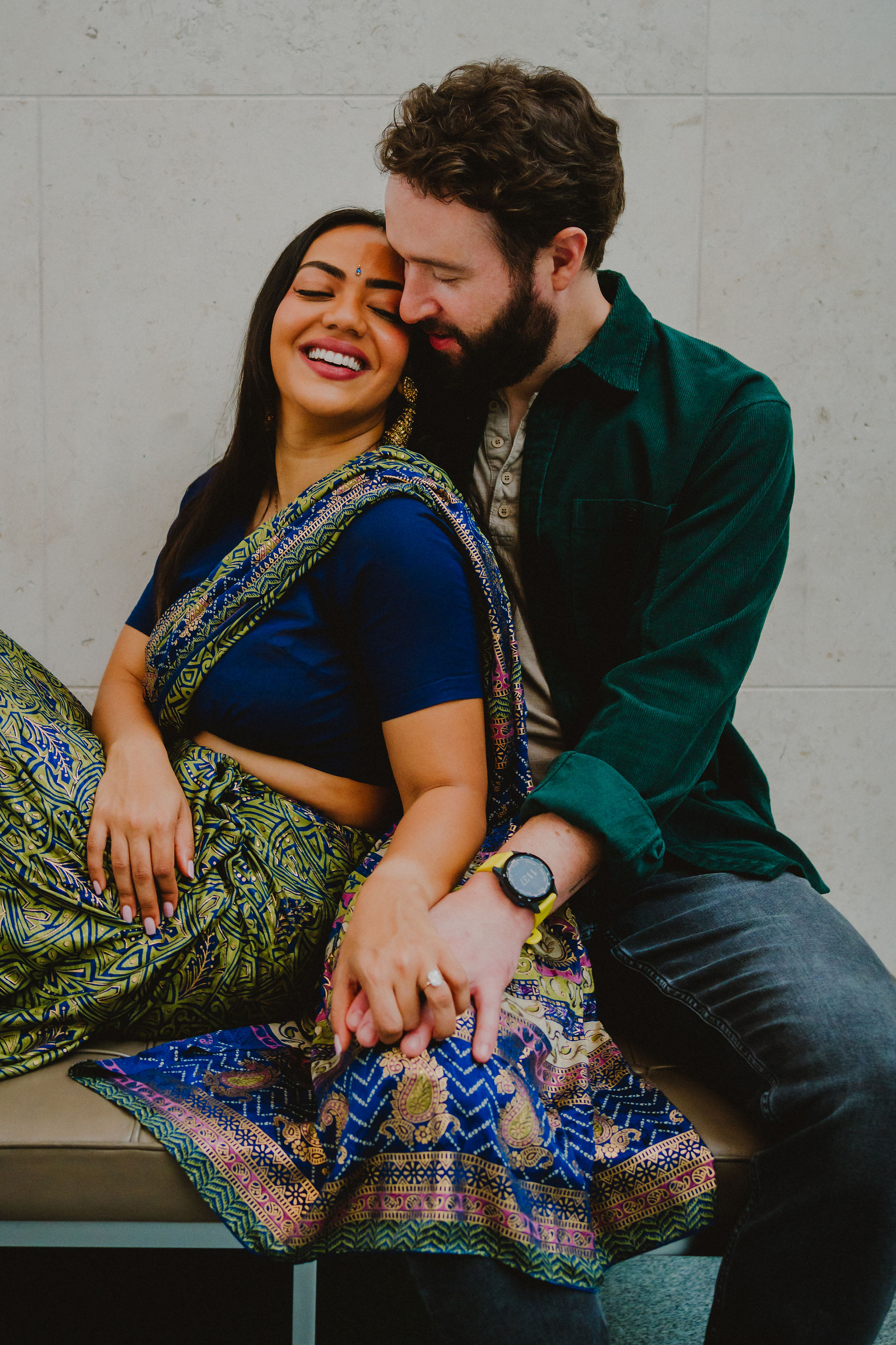 engaged couple lounging in lobby at museum in Boston