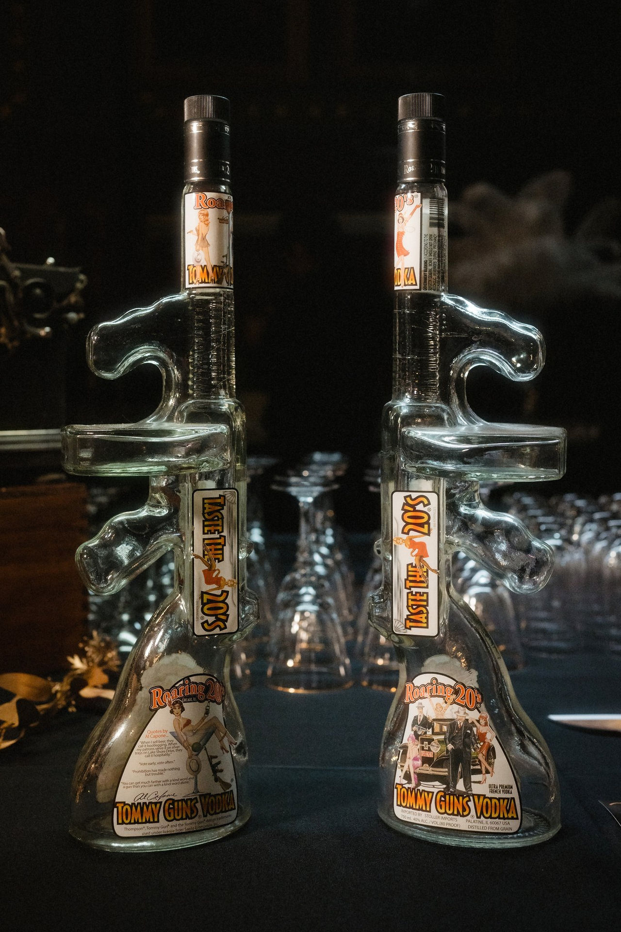 Glass Tommy Gun shaped vodka bottles on a table in Maine