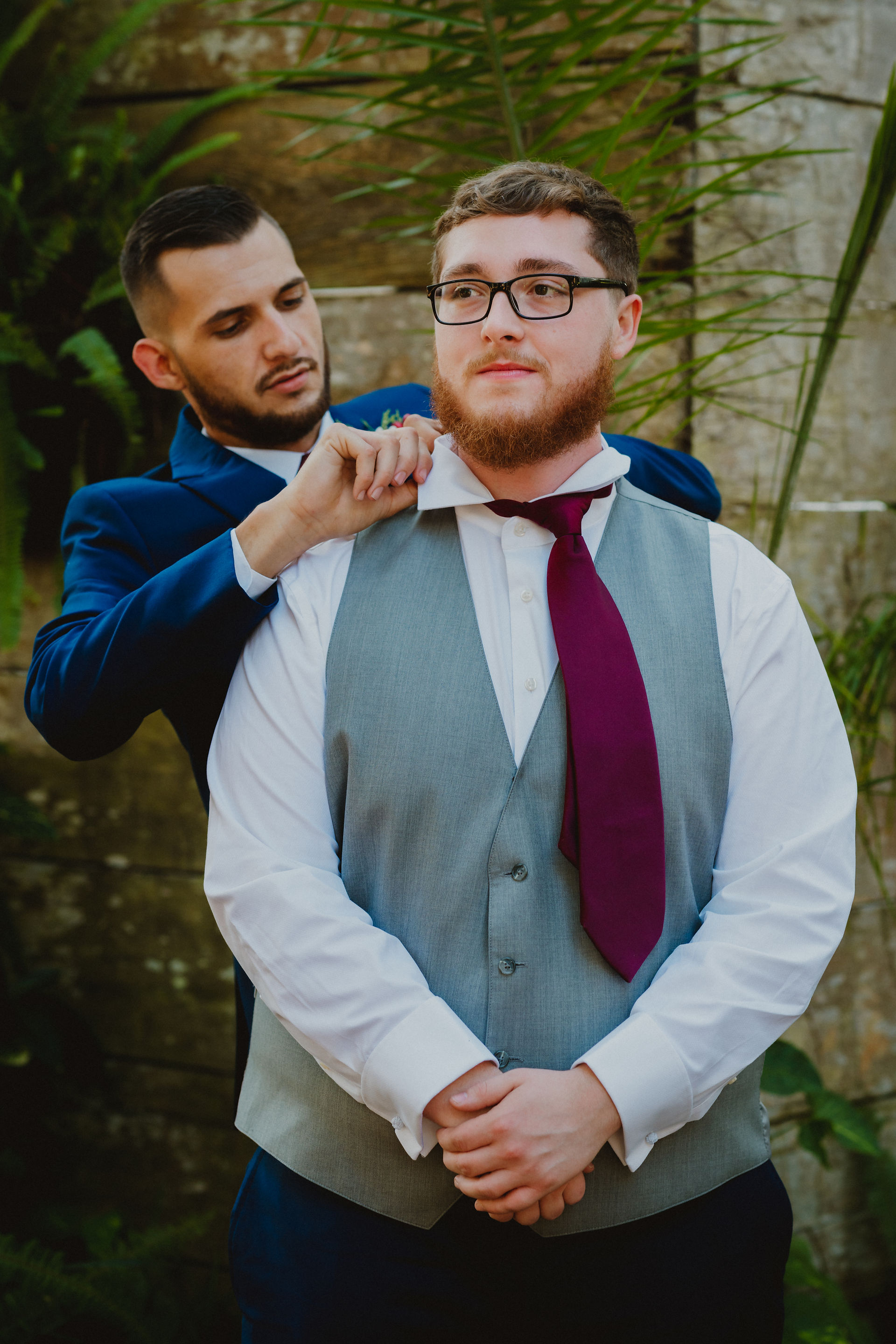 groom and his best man getting ready outdoors