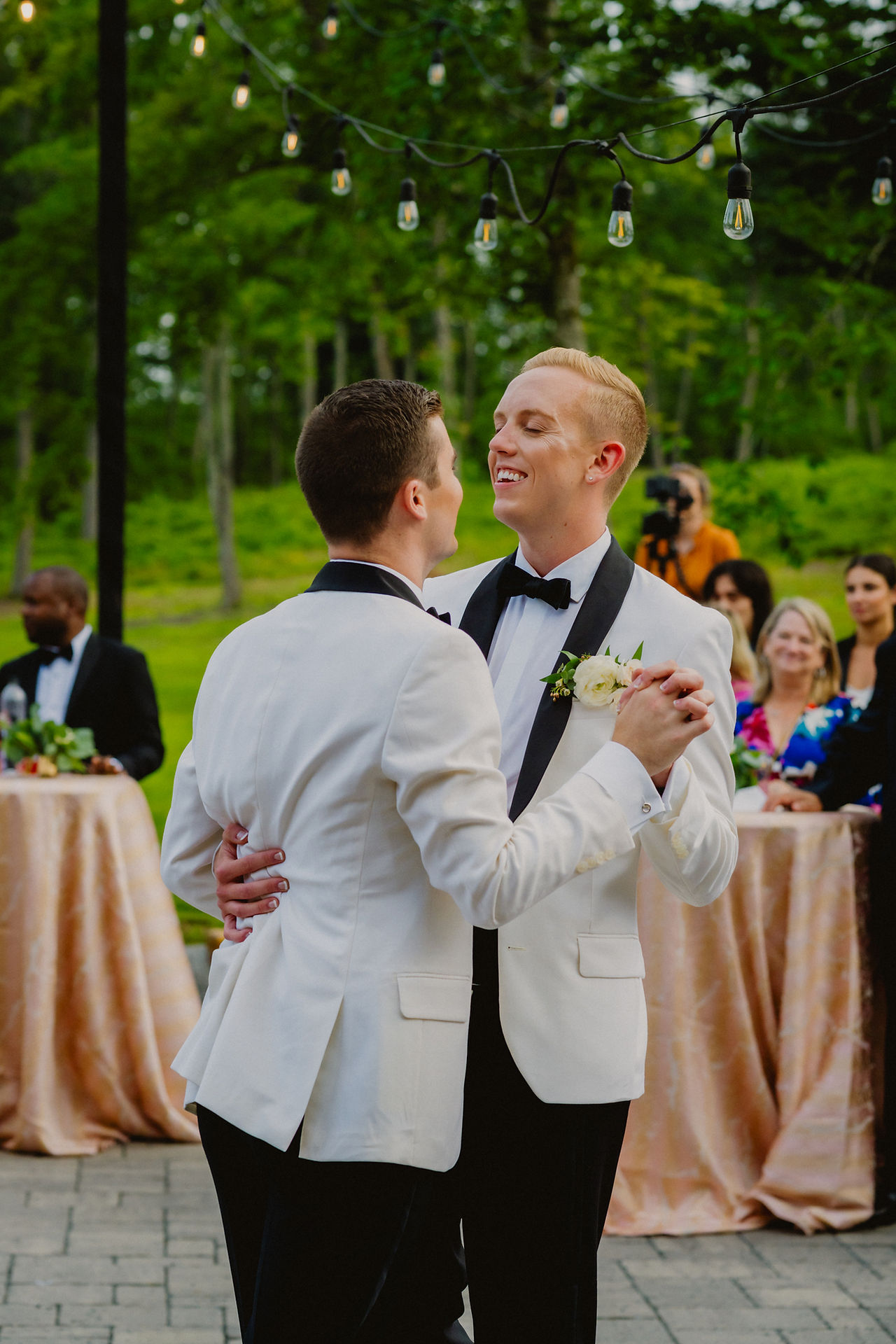 two grooms first dance at wedding reception at Autumn Lane Estate in Sebago, Maine