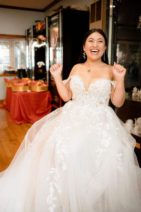 bride full of excitement and giggles before her wedding ceremony in connecticut