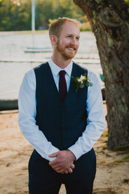 Groom reaction as bride starts walking down aisle at wedding