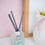 Thumbnail: eco friendly reed diffuser on a pink background