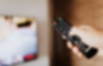 tv remote in hand