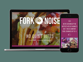 Laptop and phone showing food truck website