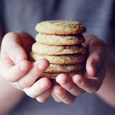 Child holding freshly baked sugar cookies_edited.jpg