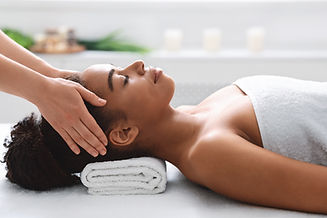 young-black-woman-getting-head-massage-from-massag-2023-11-27-05-24-20-utc.jpg