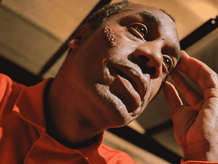 Joe Morton as Martin Wells looks upward with one hand near his face in a close-up from The X-Files Season 8 episode Redrum.