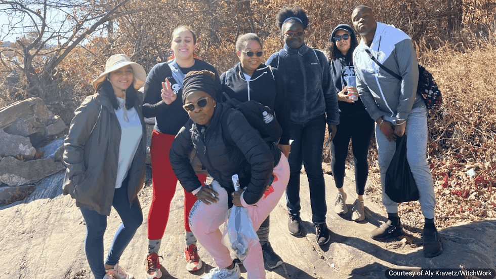 Attendees from a past BetterWitch STAYcation share a group hike near the water. Image courtesy of Aly Kravetz / WitchWork.