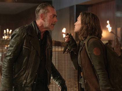 Lauren Cohan as Maggie and Jeffrey Dean Morgan as Negan stand by a brick wall in an alley in a scene from The Walking Dead: Dead City