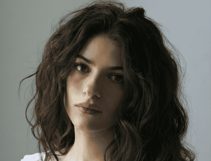  actor Ella Rubin with long dark wavy hair
