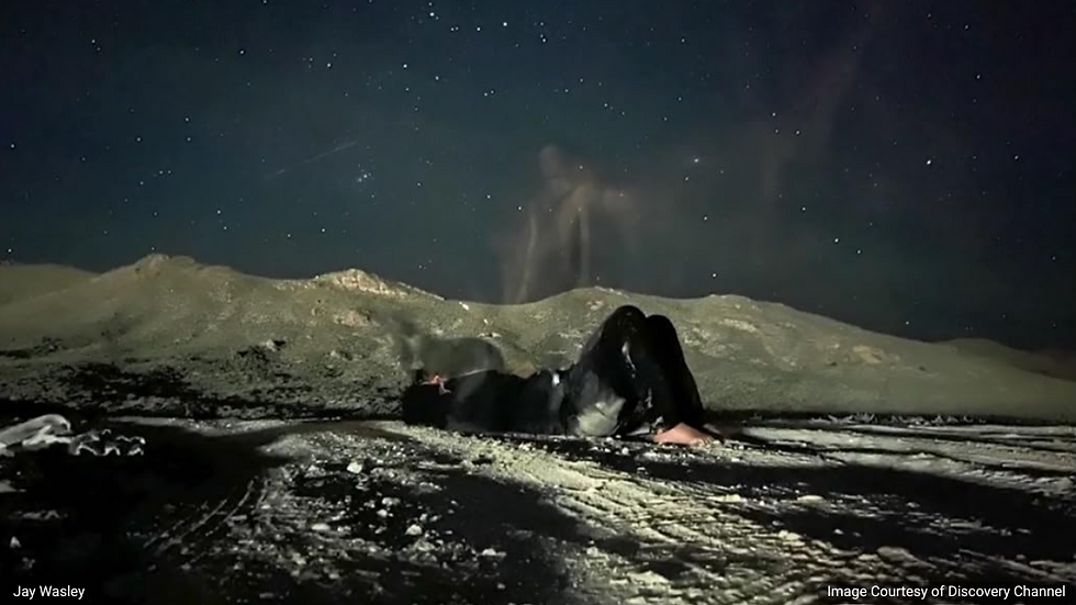 Image of Jay Wasley with a picture of what looks like a ghost rising above the Discovery Channel
