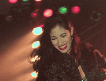 Selena Quintanilla on stage-Selena y Los Dinos: A Family’s Legacy: Image Courtesy of Netflix