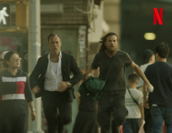 Image of Jason Bateman as Vince Friedken and Jude Law as Jake Friedken in Black Rabbit (2025)