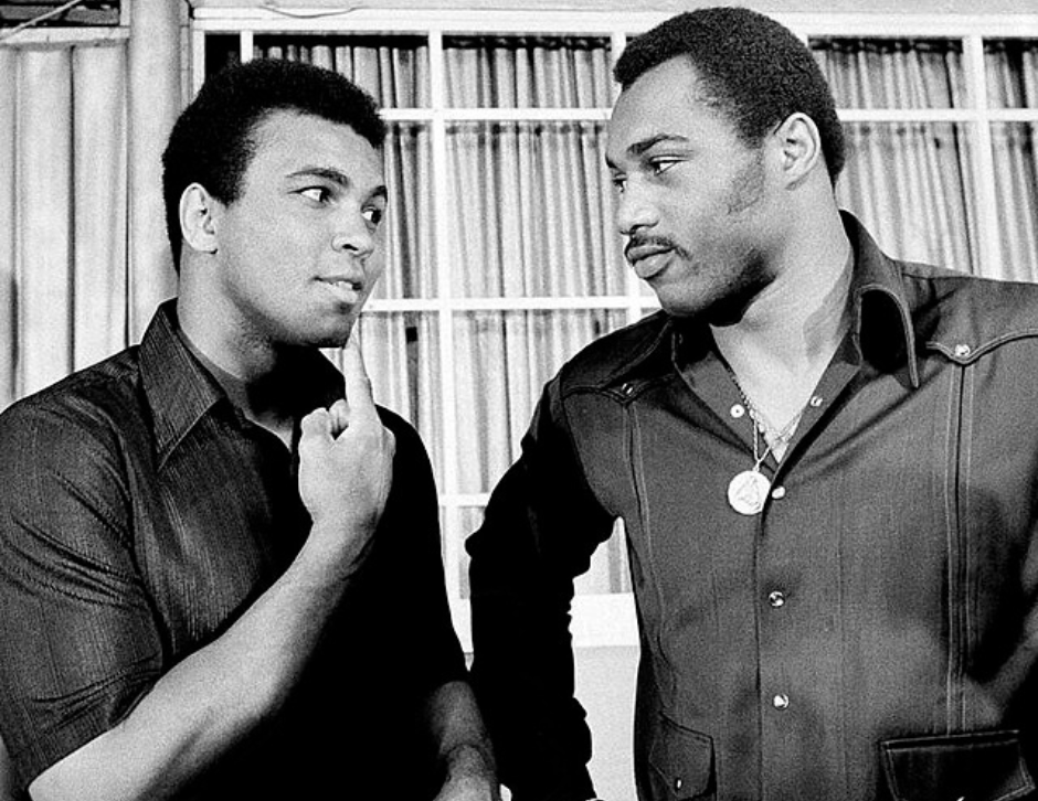 Press photo of Muhammad Ali with Ken Norton in New York, 1973. Ali points to his jaw where Norton broke it during their March 31 fight.