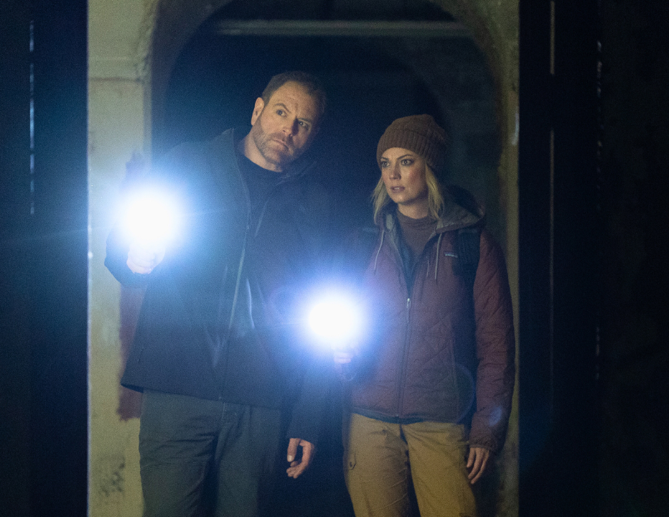 Image of Heather Amaro and Josh Gates discussing a game plan for their investigation of Ireland's Spike Island-ExpeditionX-August2025