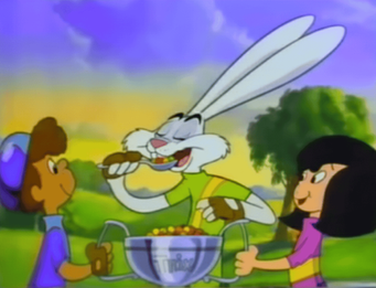Screenshot from a 1991 Trix cereal commercial depicting the Tour de Trix bicycle race trophy presentation. Image used for editorial context.