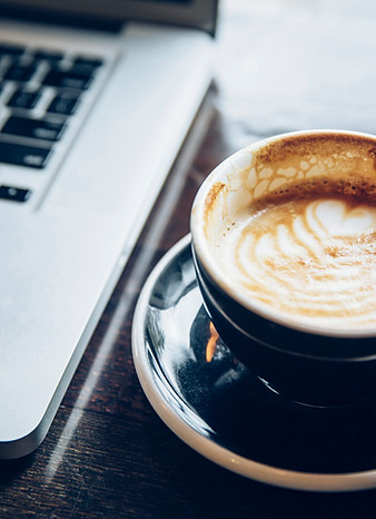 Office laptop and heart coffee latte connecting