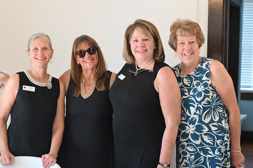 Four smiling women at a Growth & Learning event