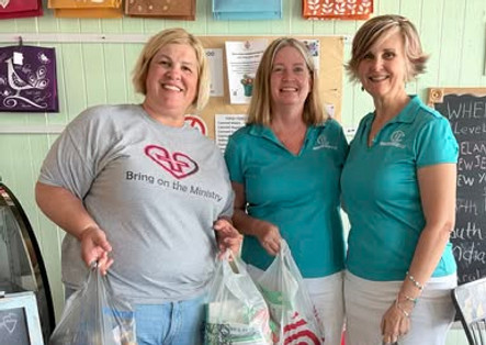 Bradenton Woman’s Club members Melanie and Paula organizing food donations on May 9, 2026