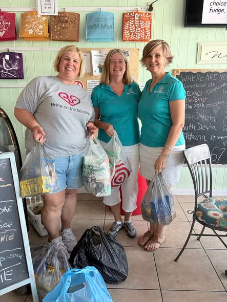 Bradenton Woman’s Club members Melanie and Paula organizing food donations on May 9, 2026