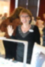 Woman waving at a Recent Events gathering