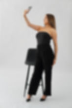 JCreate founder in black outfit studio portrait – luxury branding and social media agency Canberra