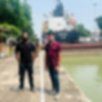 "A specialized dredging vessel and diving team conducting channel cleaning and underwater inspection at the Syama Prasad Mookerjee Port shipping channel in Kolkata."