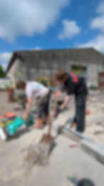 Sam and Lewis mixing concrete