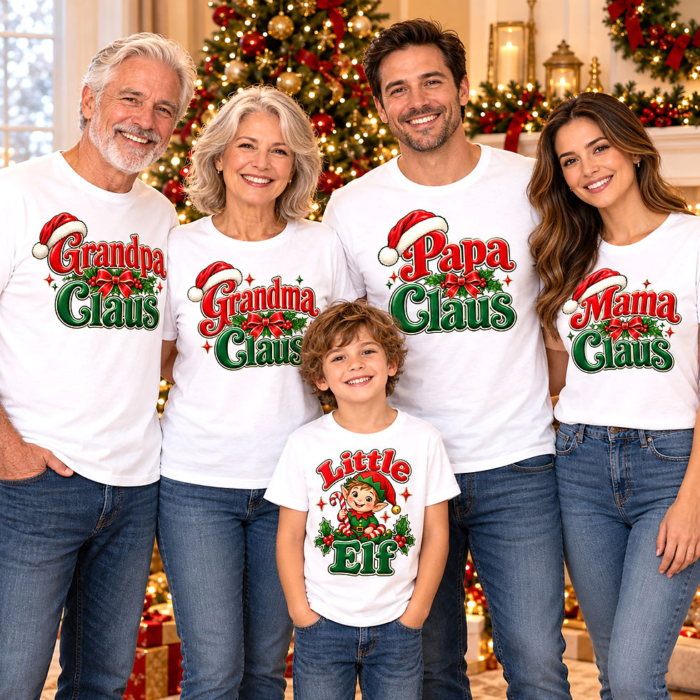 Three generations of a smiling family wearing matching Christmas shirts with Grandpa Claus, Grandma Claus, Papa Claus, Mama Claus, and Little Elf designs in red and green, posing in front of a decorated Christmas tree.