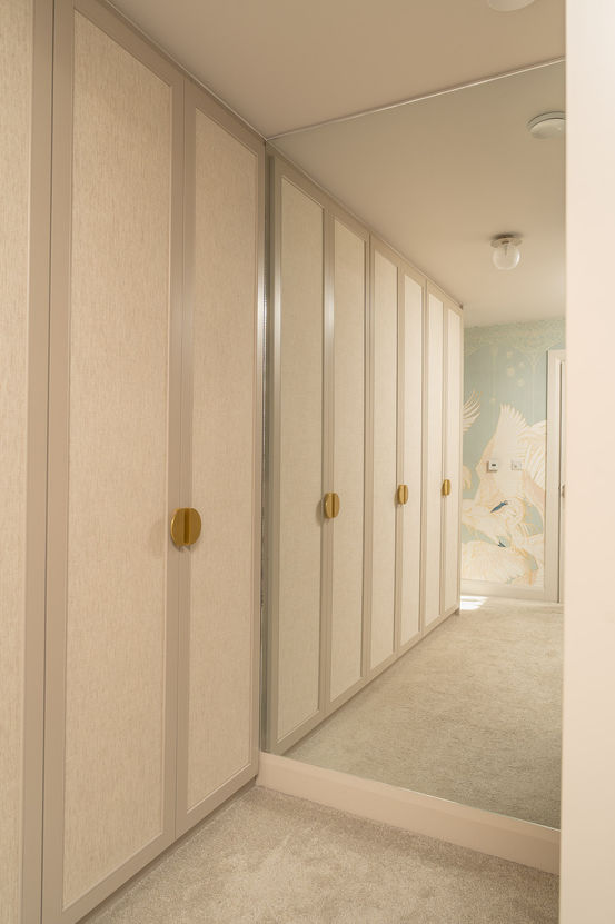 a hallway with a painting of a swan on the wall
