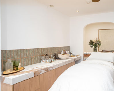 a room with a table and a vase of flowers