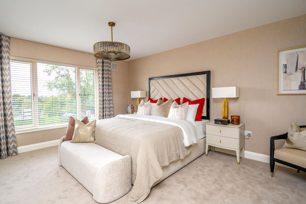 a bedroom with a large bed and two nightstands