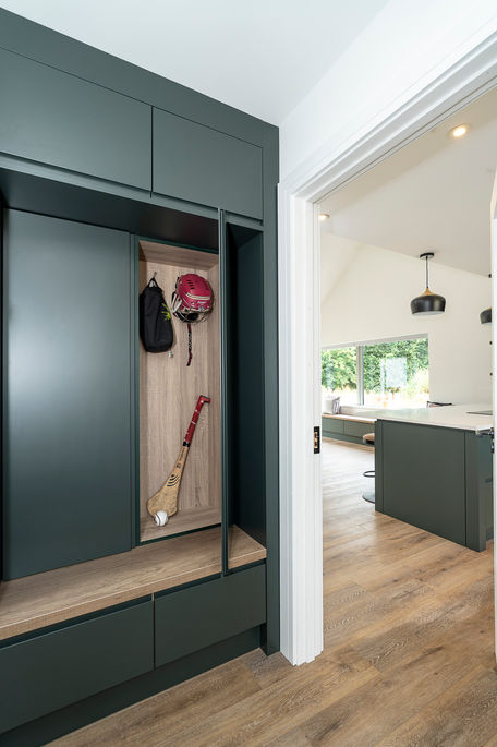 a helmet is hanging on a hook in a closet