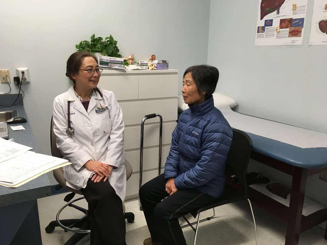 Dr. Zhu and Patient.jpg
