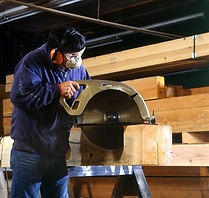 worker using a saw